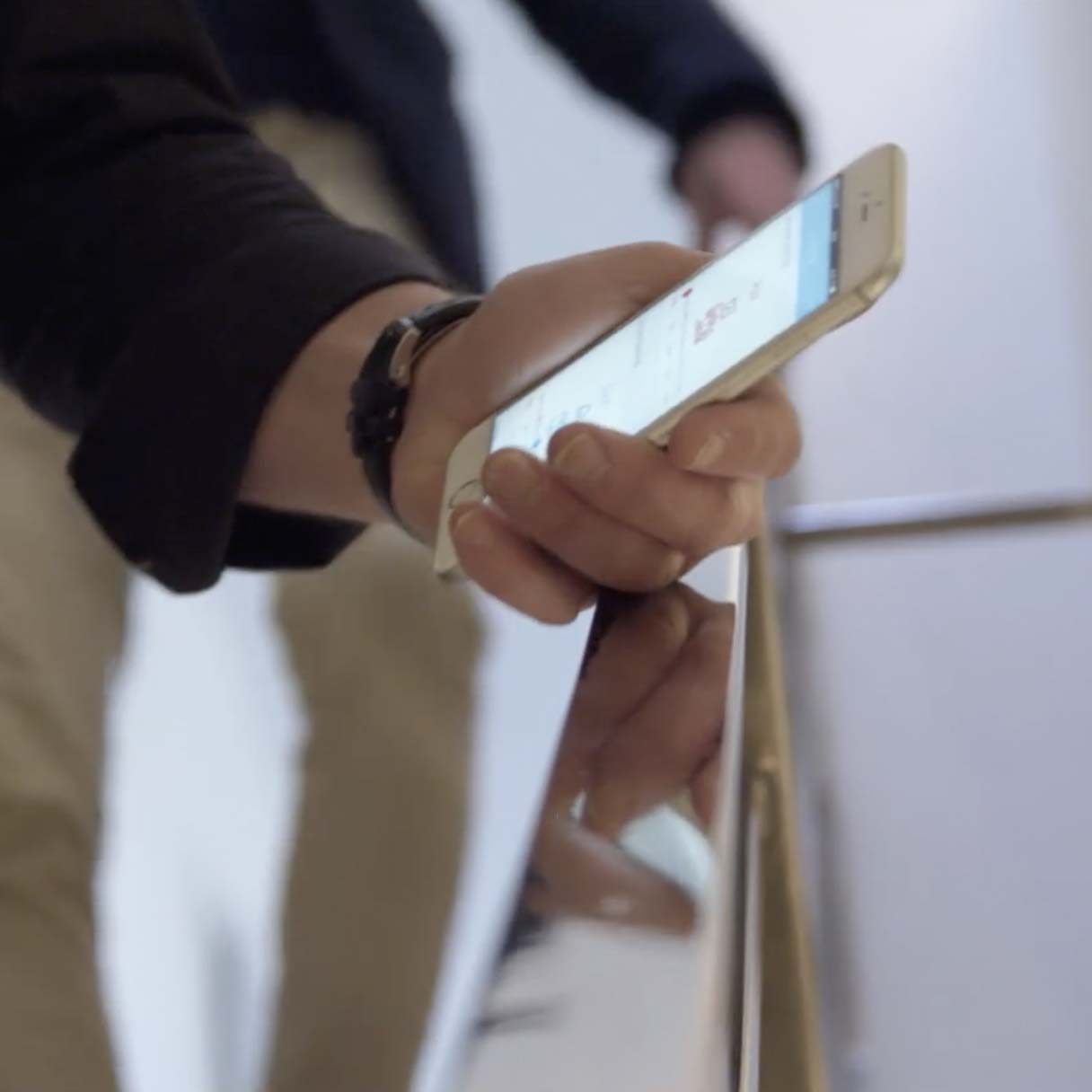 Man holding phone showing the SweepBright app